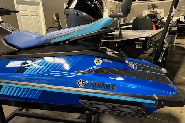 Slide: The Image of 2023 Yamaha WaveRunner EX Limited in showroom, blue and black design. - 6