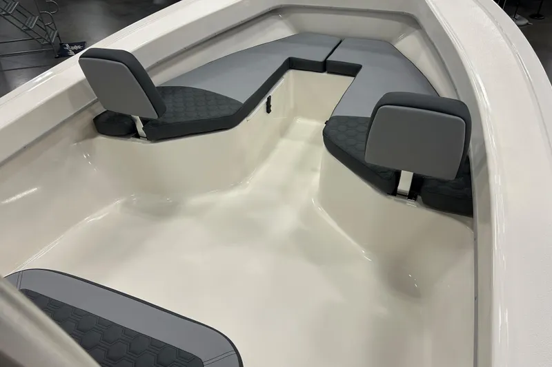 Slide: The Image of 2026 Maycraft 238CC boat interior with gray cushioned seating and sleek design. - 14