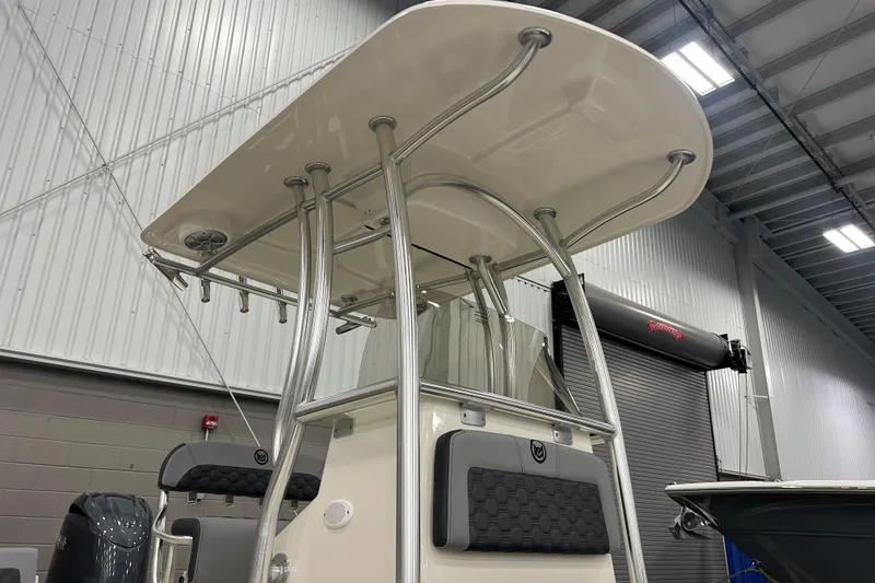 Slide: The Image of 2026 Maycraft 238CC boat with T-top in a warehouse setting. - 4
