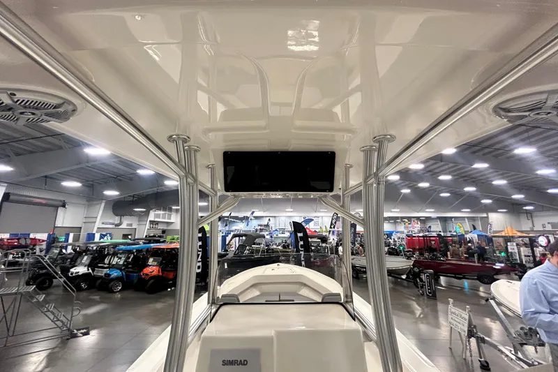 Slide: The Image of 2026 Maycraft 238CC boat interior at a showroom, featuring sleek design and modern equipment. - 9