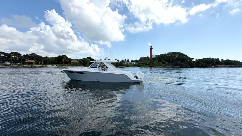 Slide: The Image of Intrepid 35 VALOR 2026 on calm water near a lighthouse. - 1