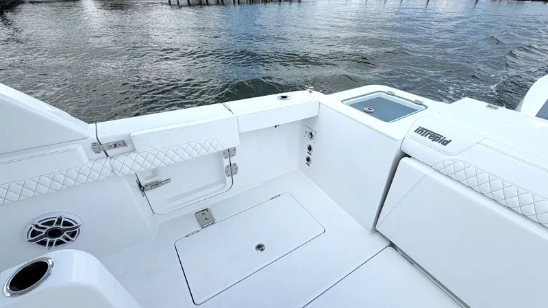 Slide: The Image of The image shows the stern of an Intrepid 35 VALOR boat on the water. - 11