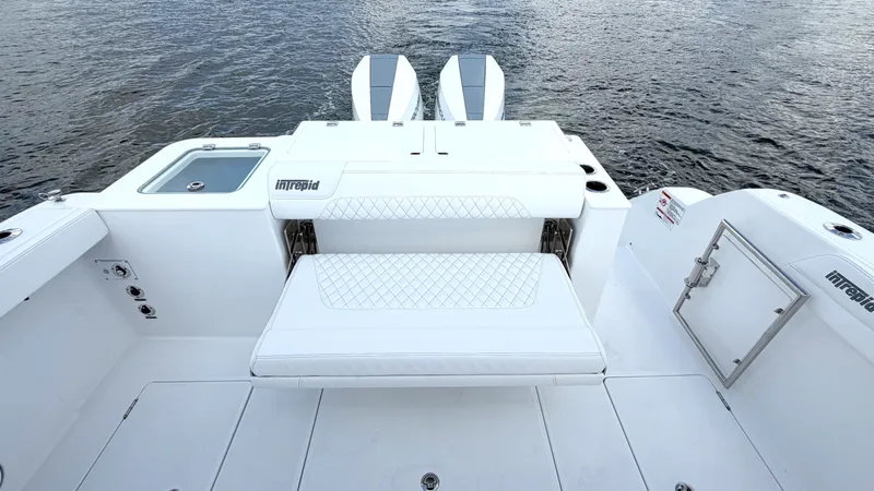 Slide: The Image of Intrepid 35 VALOR 2026: Spacious aft deck with seating and water access. - 12