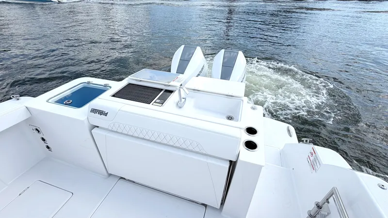 Slide: The Image of Intrepid 35 VALOR 2026 with twin outboard engines on calm water. - 16