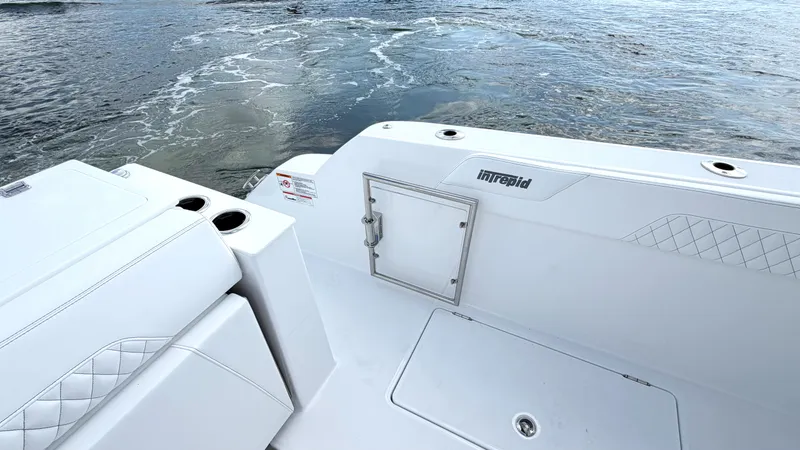 Slide: The Image of Intrepid 35 VALOR 2026: Sleek white deck with quilted details, on calm water. - 17