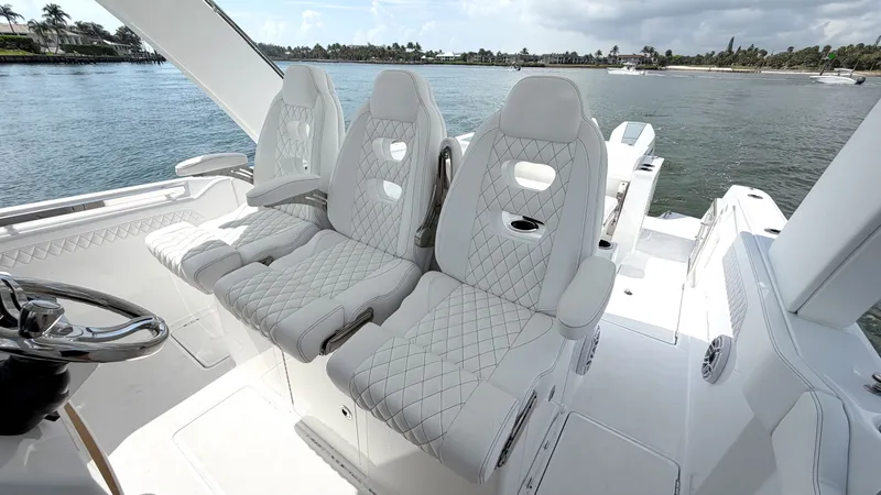 Slide: The Image of Intrepid 35 VALOR 2026: Luxurious quilted seats on a boat overlooking calm waters. - 18