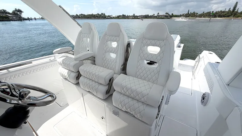 Slide: The Image of Intrepid 35 VALOR 2026: Luxurious quilted seats on a boat overlooking calm waters. - 19