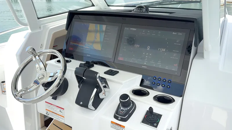 Slide: The Image of Intrepid 35 VALOR 2026: Modern cockpit with dual large screens and control elements. - 23
