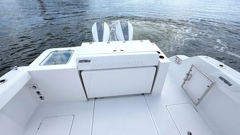 Slide: The Image of The image shows the stern of an Intrepid 35 VALOR boat on the water. - 24