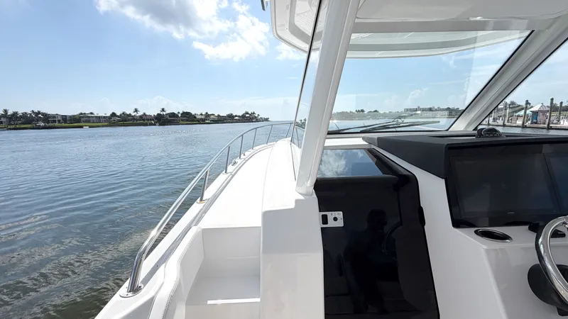 Slide: The Image of Intrepid 35 VALOR 2026 on calm water with a modern cockpit. - 30
