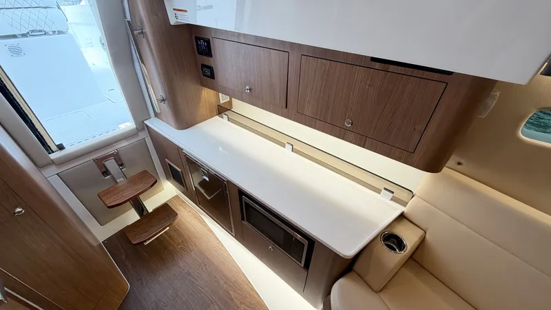 Slide: The Image of Interior of the 2026 Intrepid 35 VALOR with sleek wood cabinetry and modern amenities. - 34