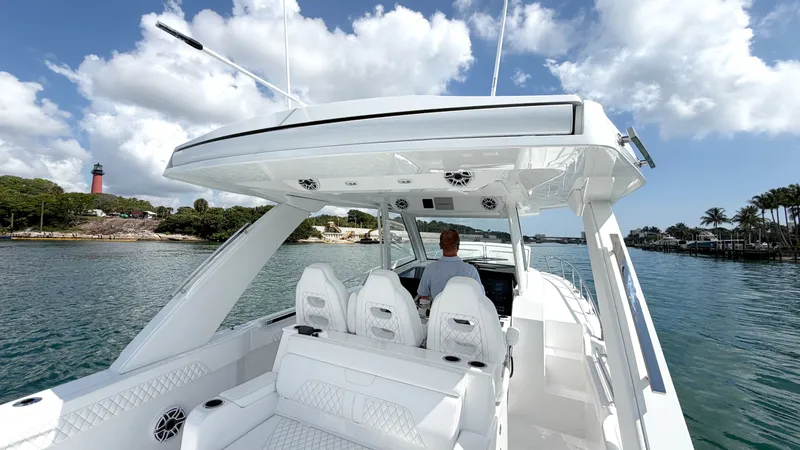 Slide: The Image of Intrepid 35 VALOR 2026 on calm water with a lighthouse in the background. - 7
