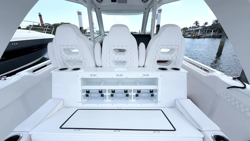 Slide: The Image of Intrepid 35 VALOR 2026: Luxurious interior with white seating and a view of the water. - 8