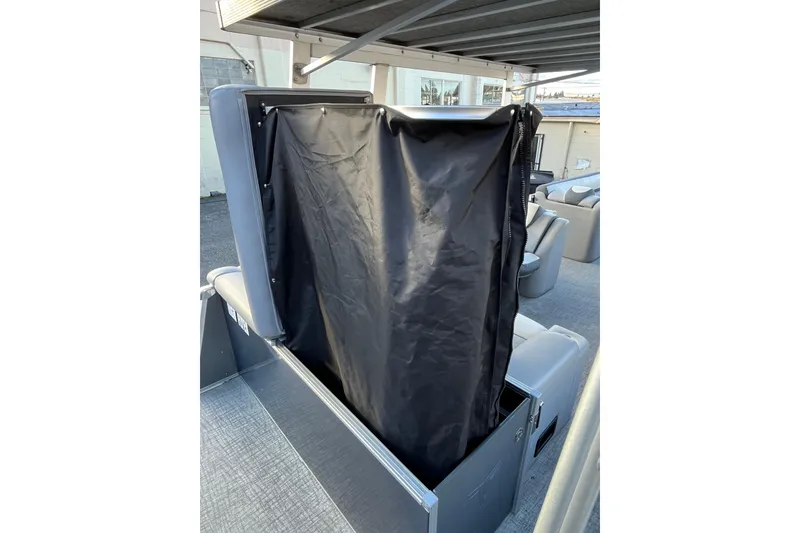 Slide: The Image of 2025 Tahoe Pontoon Cascade Cruise Funship interior with black privacy curtain. - 10