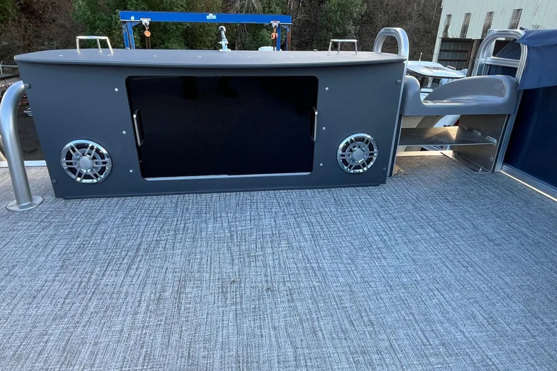 Slide: The Image of 2025 Tahoe Pontoon Cascade Cruise Funship deck with speakers and seating area. - 13