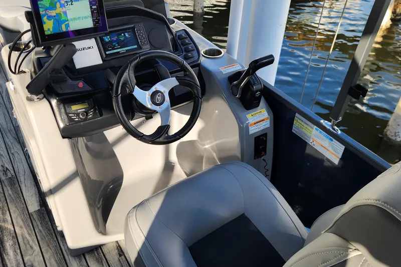 Slide: The Image of 2023 Veranda Fish VF25F2plus2 boat cockpit with steering wheel and navigation system. - 10