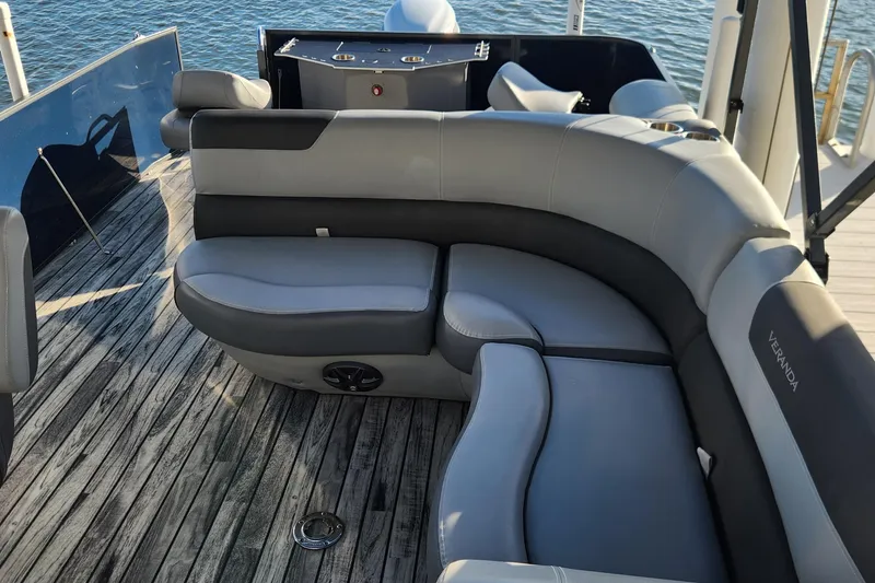 Slide: The Image of 2023 Veranda Fish VF25F2plus2 boat with luxurious seating on wooden deck. - 14
