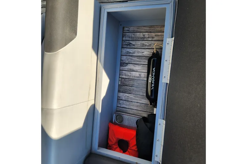 Slide: The Image of Storage compartment in 2023 Veranda Fish VF25F2plus2 boat with life jacket and fender. - 16