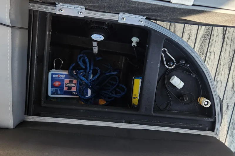 Slide: The Image of Storage compartment in 2023 Veranda Fish VF25F2plus2 boat with safety gear and accessories. - 17
