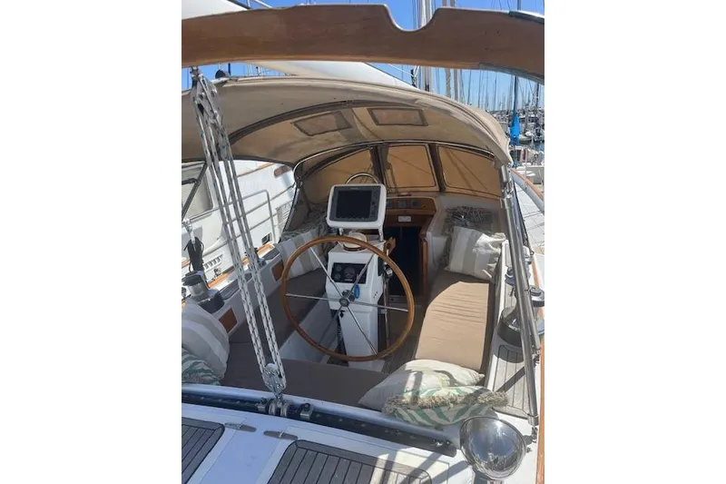 Slide: The Image of Sailboat Liberty 49, 1986 model, with a ladder and orange kayak on deck. - 11