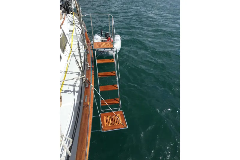 Slide: The Image of 1986 Liberty 49 yacht helm with navigation system and wooden steering wheel. - 14