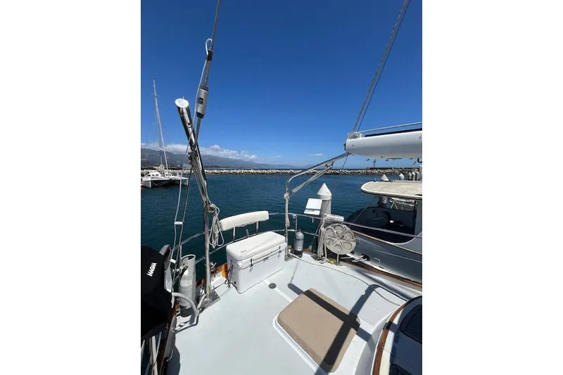 Slide: The Image of 1986 Liberty 49 sailboat cockpit with wooden wheel and navigation equipment. - 15
