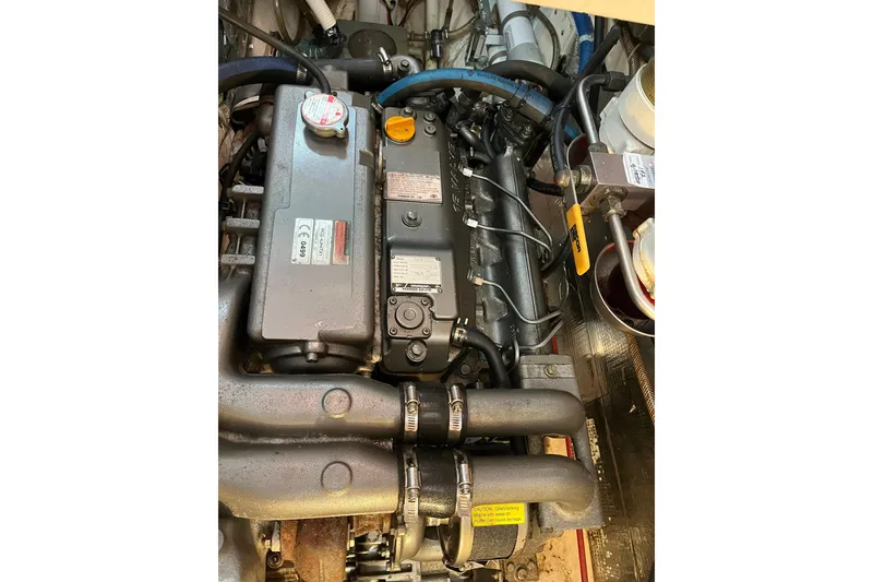 Slide: The Image of Helm of 1986 Liberty 49 sailboat with wooden wheel and navigation equipment. - 17