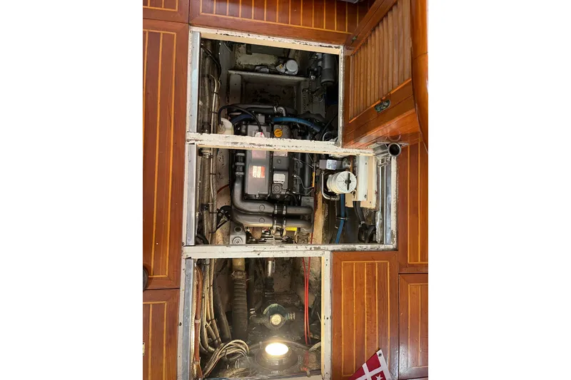 Slide: The Image of Cockpit view of 1986 Liberty 49 sailboat with wooden steering wheel and canopy. - 18