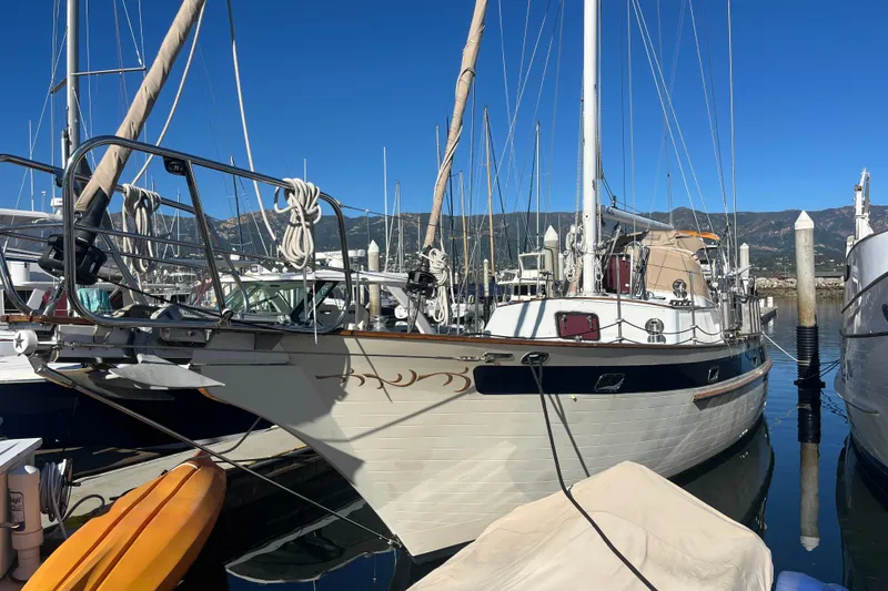 Slide: The Image of Sailing yacht Liberty 49 from 1986 on calm blue ocean waters. - 2