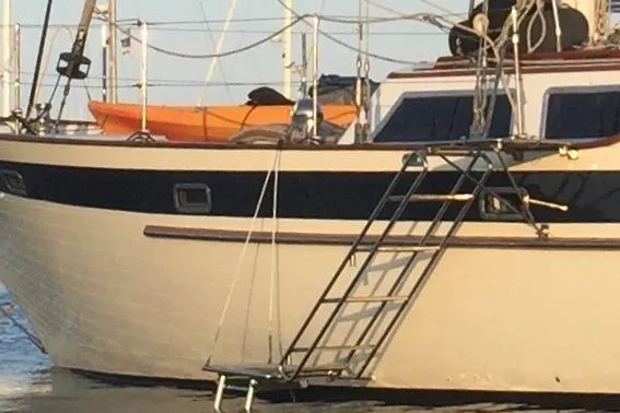 Slide: The Image of Cockpit of 1986 Liberty 49 sailboat with wooden flooring and winches. - 21