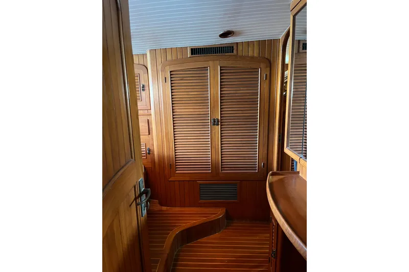 Slide: The Image of Interior of 1986 Liberty 49 yacht with wooden furnishings and elegant design. - 33