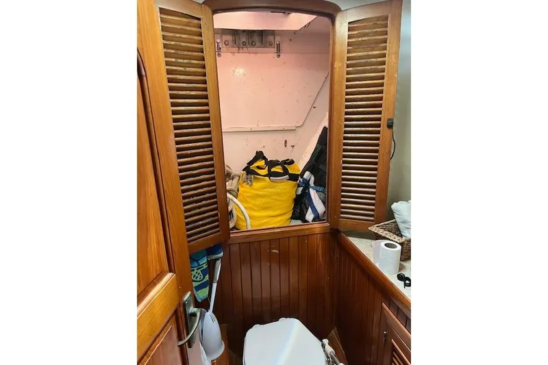 Slide: The Image of Sailing on a 1986 Liberty 49 yacht with vibrant blue and white sails. - 4