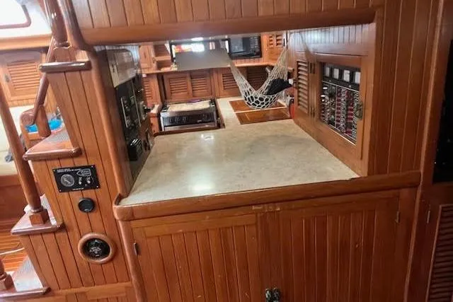Slide: The Image of Wooden interior of 1986 Liberty 49 yacht with desk and storage cabinets. - 41
