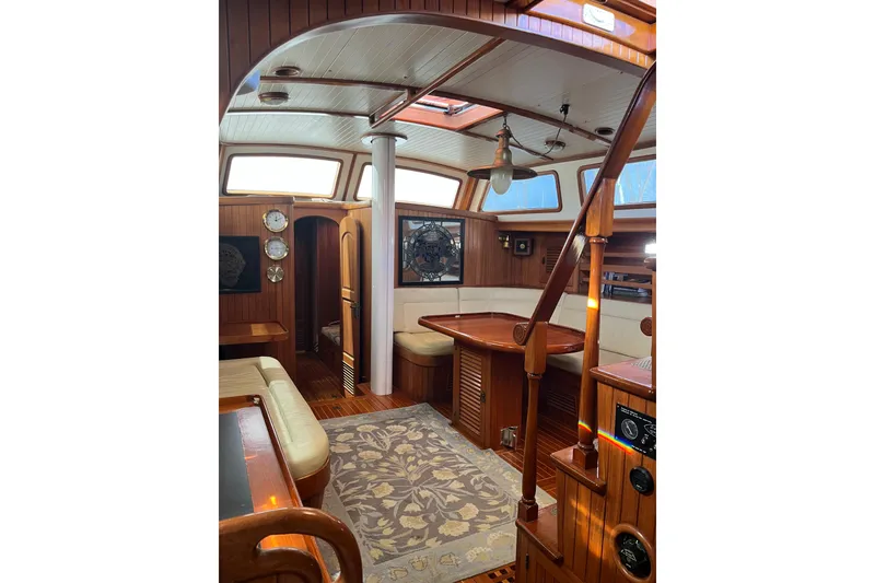 Slide: The Image of Interior of 1986 Liberty 49 yacht with wooden cabinetry and flooring. - 42