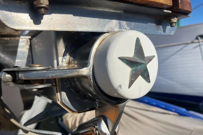 Slide: The Image of Engine compartment of 1986 Liberty 49 boat with wooden flooring and open access panels. - 51