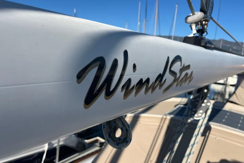 Slide: The Image of 1986 Liberty 49 shower interior with wooden trim and handheld showerhead. - 53