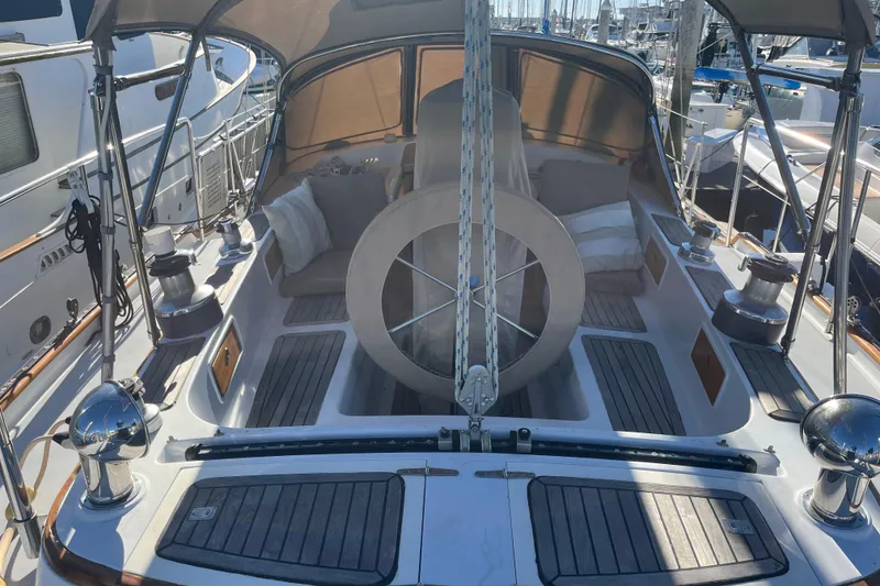 Slide: The Image of 1986 Liberty 49 yacht bathroom with wooden cabinetry and fire extinguisher. - 54