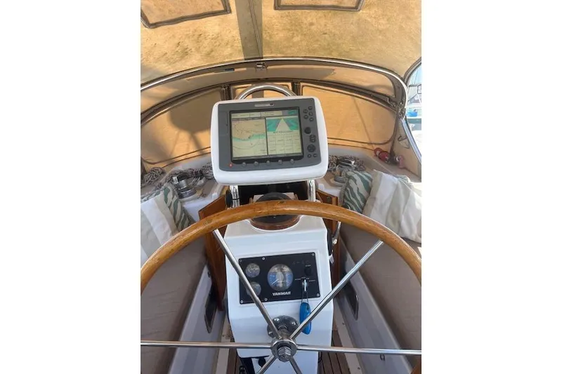 Slide: The Image of Sailboat docked at marina, Liberty 49 model, 1986, with clear blue sky and mountains. - 7