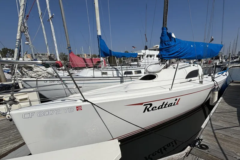 Slide: The Image of Sailboat "Redtail" docked, Flying Tiger FT-10M, 2007 model, marina setting. - 2
