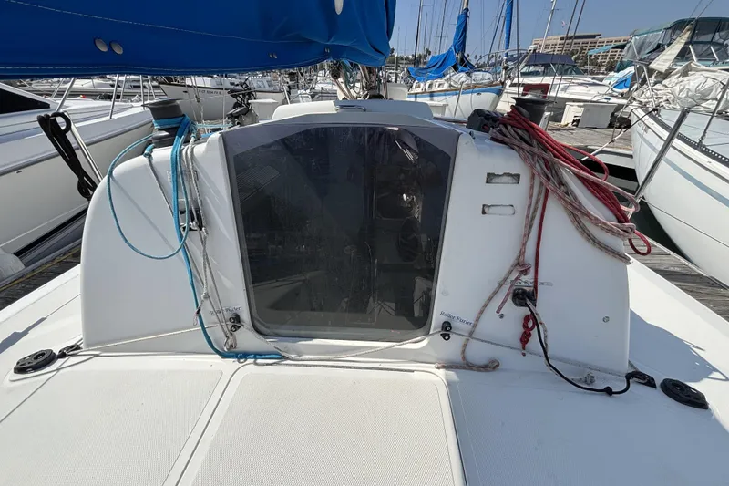 Slide: The Image of Sailboat cockpit of 2007 Flying Tiger FT-10M, docked with ropes and blue canopy. - 21