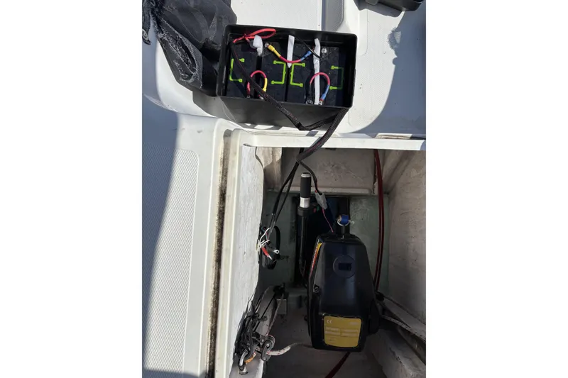 Slide: The Image of Battery compartment of a 2007 Flying Tiger FT-10M sailboat, showing wiring and components. - 25