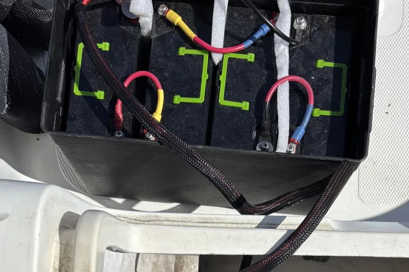 Slide: The Image of Battery compartment of a 2007 Flying Tiger FT-10M with connected cables. - 26