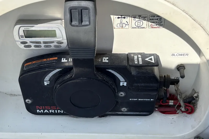 Slide: The Image of Control panel of a 2007 Flying Tiger FT-10M boat with throttle and switches. - 29