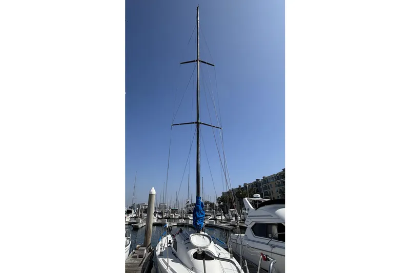 Slide: The Image of Sailboat docked in marina, Flying Tiger FT-10M, 2007 model, under clear blue sky. - 3