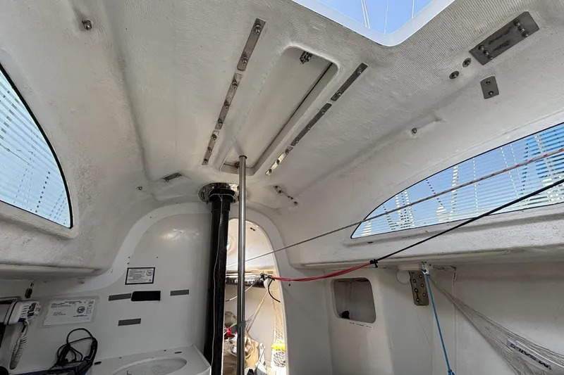 Slide: The Image of Interior view of a 2007 Flying Tiger FT-10M sailboat cabin with visible rigging. - 32