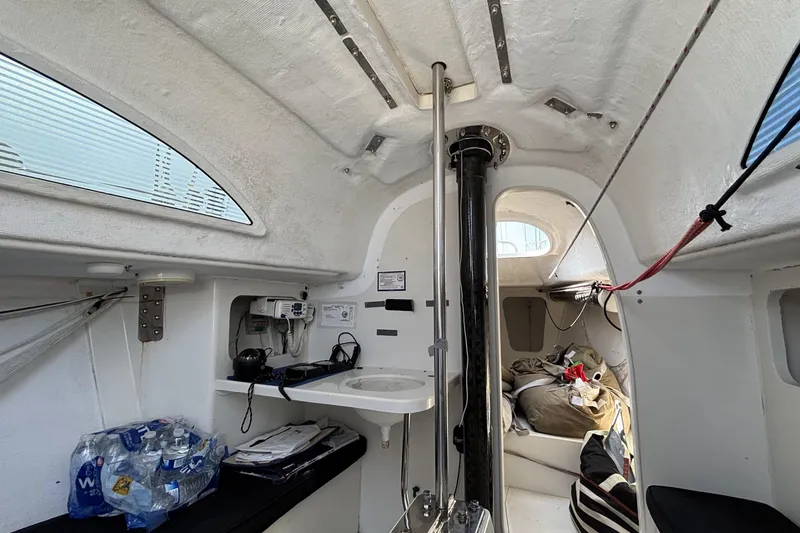 Slide: The Image of Interior of 2007 Flying Tiger FT-10M sailboat, featuring navigation equipment and storage. - 33