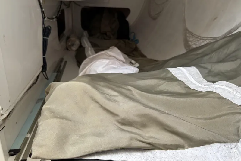 Slide: The Image of Interior of a 2007 Flying Tiger FT-10M sailboat with folded sails and storage area. - 37