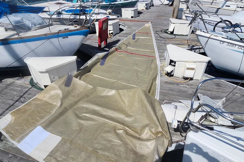 Slide: The Image of Sailboat docked with covered sail, Flying Tiger FT-10M, 2007 model, marina setting. - 43