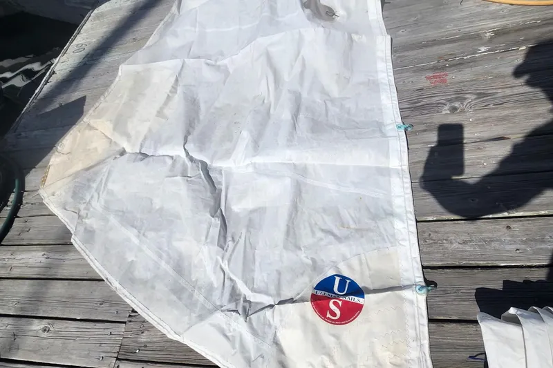 Slide: The Image of White sail on wooden deck, featuring a "US" logo, Flying Tiger FT-10M, 2007 model. - 47
