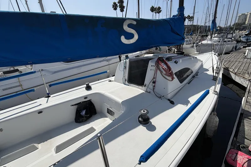 Slide: The Image of Sailboat docked at marina, Flying Tiger FT-10M, 2007 model, with blue sail cover. - 5